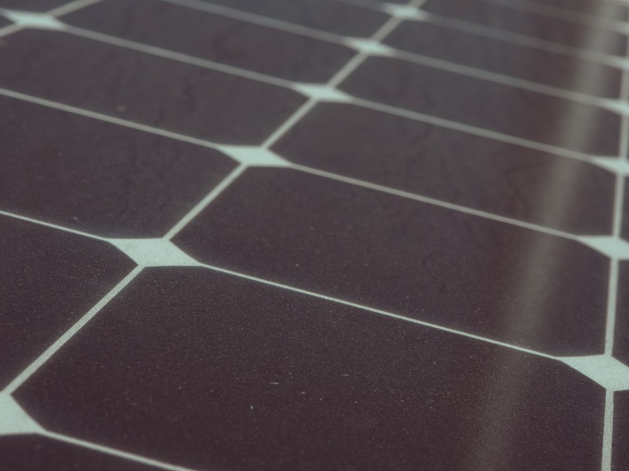 Offerings Detailed view of solar panel cells for alternative energy generation and innovation in technology.